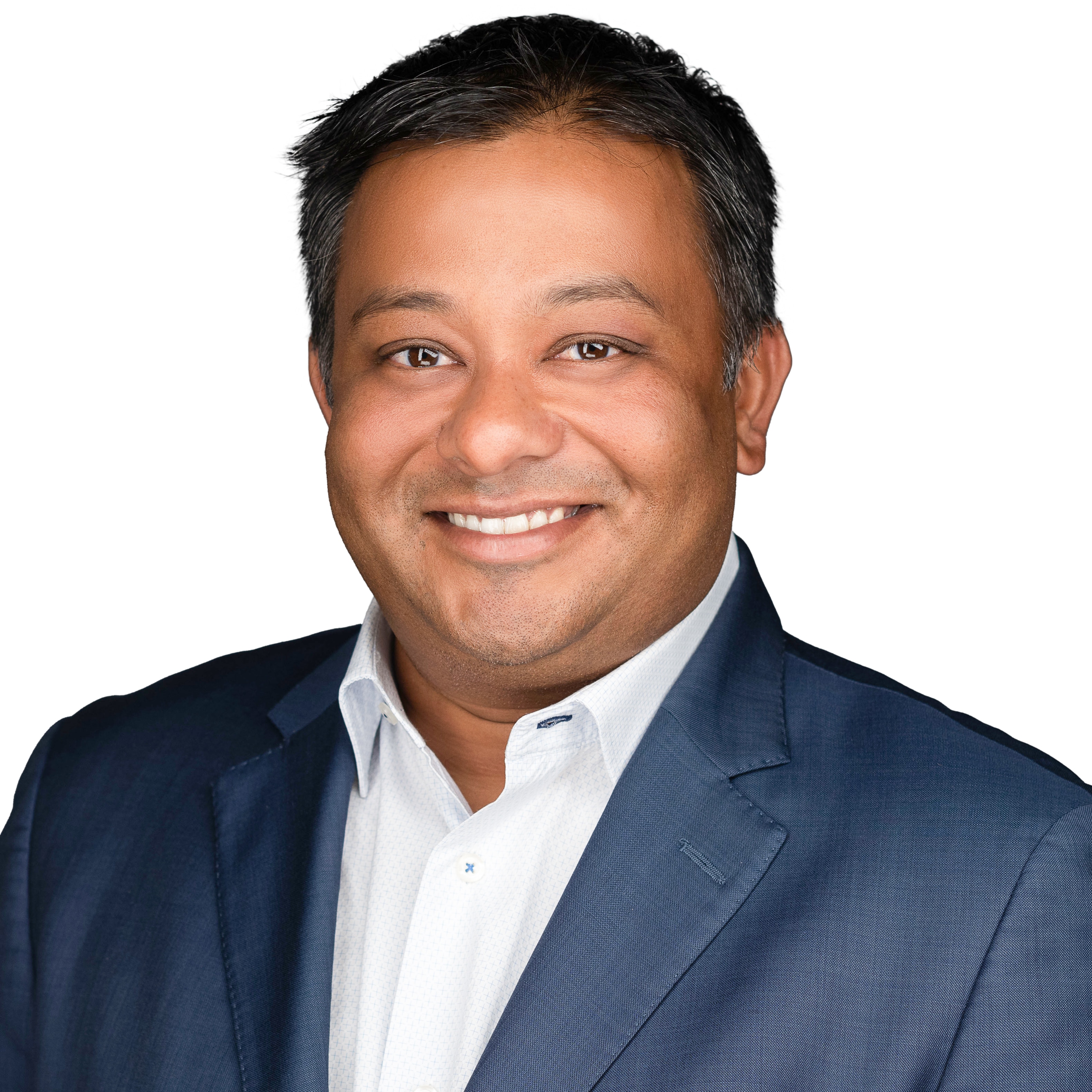 Prem Shah in front of white background